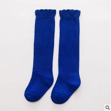 White ribbed knee-high baby socks, comfortable and warm for any baby girl.