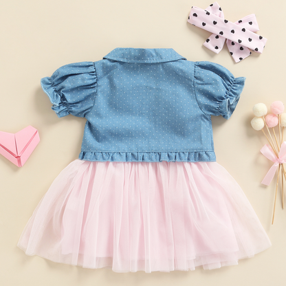 Toddler girl in a stylish 3-piece summer outfit: polka dot tulle dress, denim jacket, matching headband