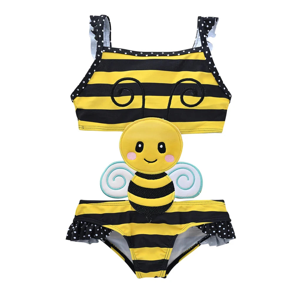 Baby girl in a fun animal print swimsuit, ready for swimming lessons