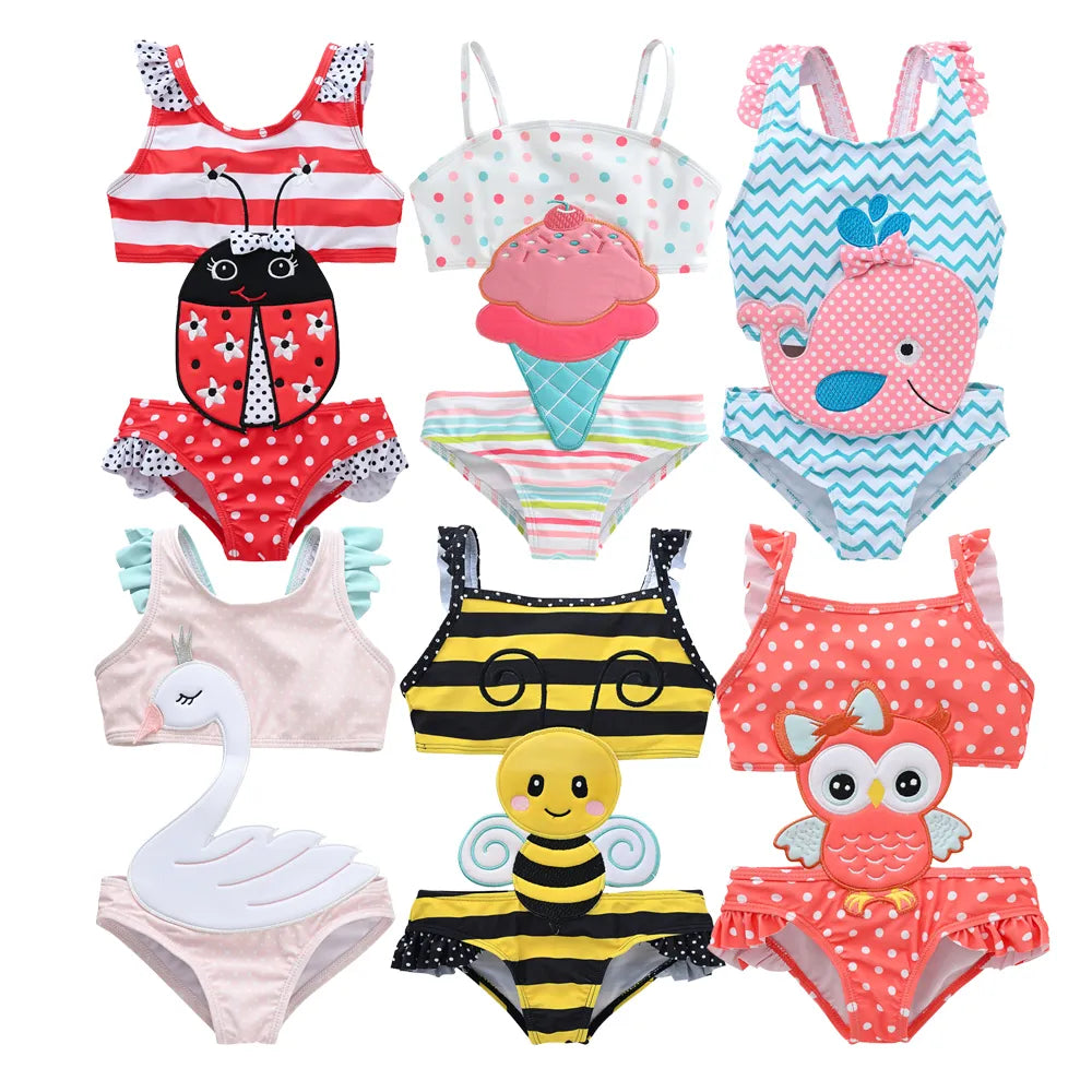 Toddler girl in adorable animal print swimsuit enjoying summer playtime