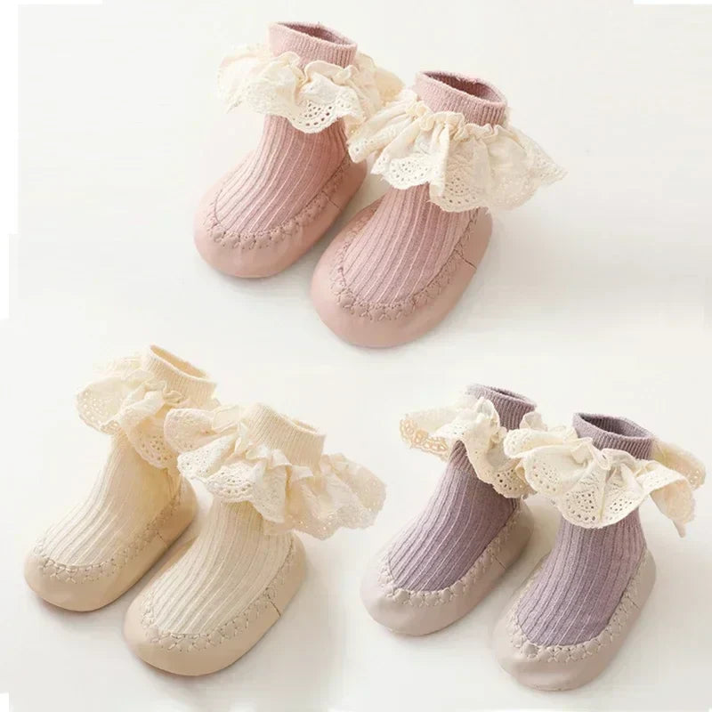Infant girl's anti-slip first walker shoes, comfortable cotton with ruffle and bow design.