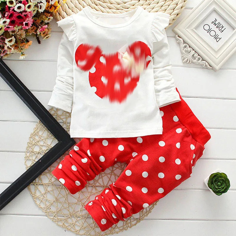Stylish baby tracksuit for girls, includes a white t-shirt with bow dots and pink trousers