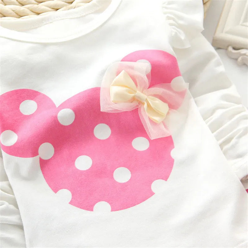 Newborn girl's clothes: a white bow dot t-shirt and soft pink pants, a lovely two-piece set