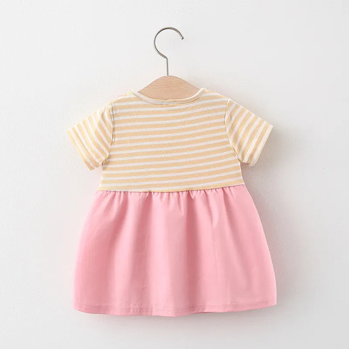 Close-up of the fabric texture on a baby girl's striped cat princess dress. Cotton blend.
