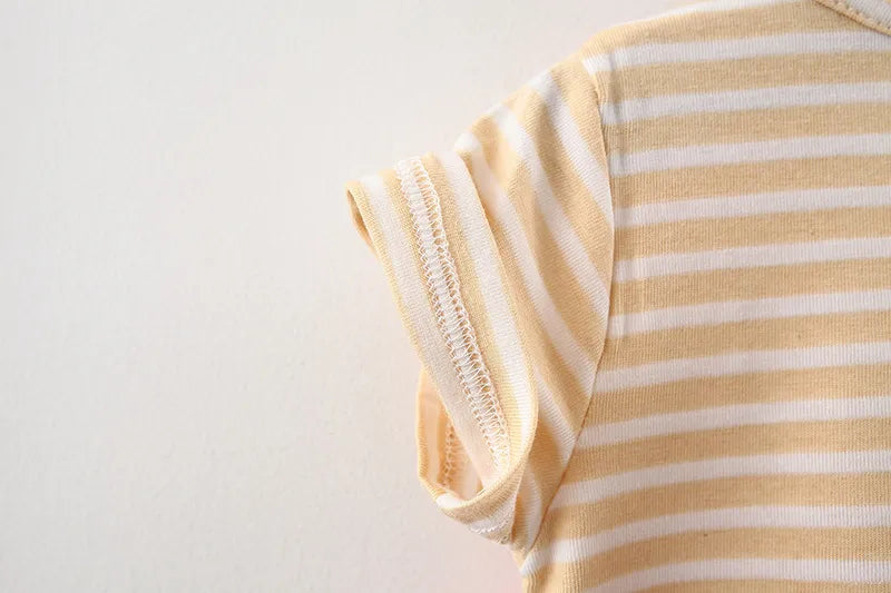 Full image of a striped baby girl's dress with a cartoon cat, perfect princess attire.