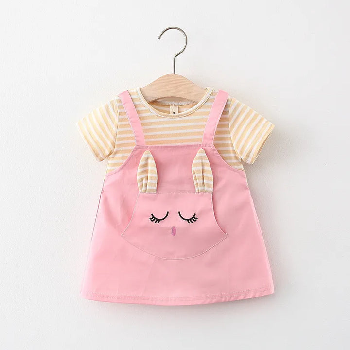 Detailed image of the striped pattern and cartoon cat on a baby girl's princess dress.