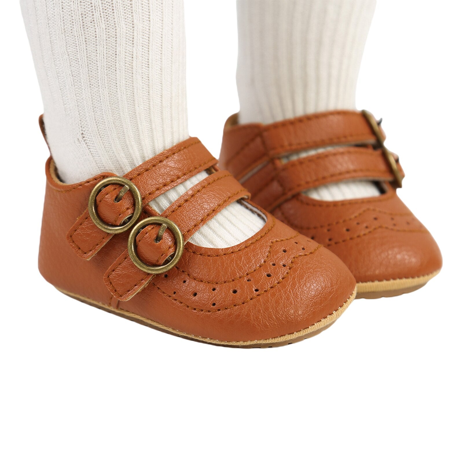 Toddler girl's anti-slip first walker shoes in white with a secure hook and loop buckle design.