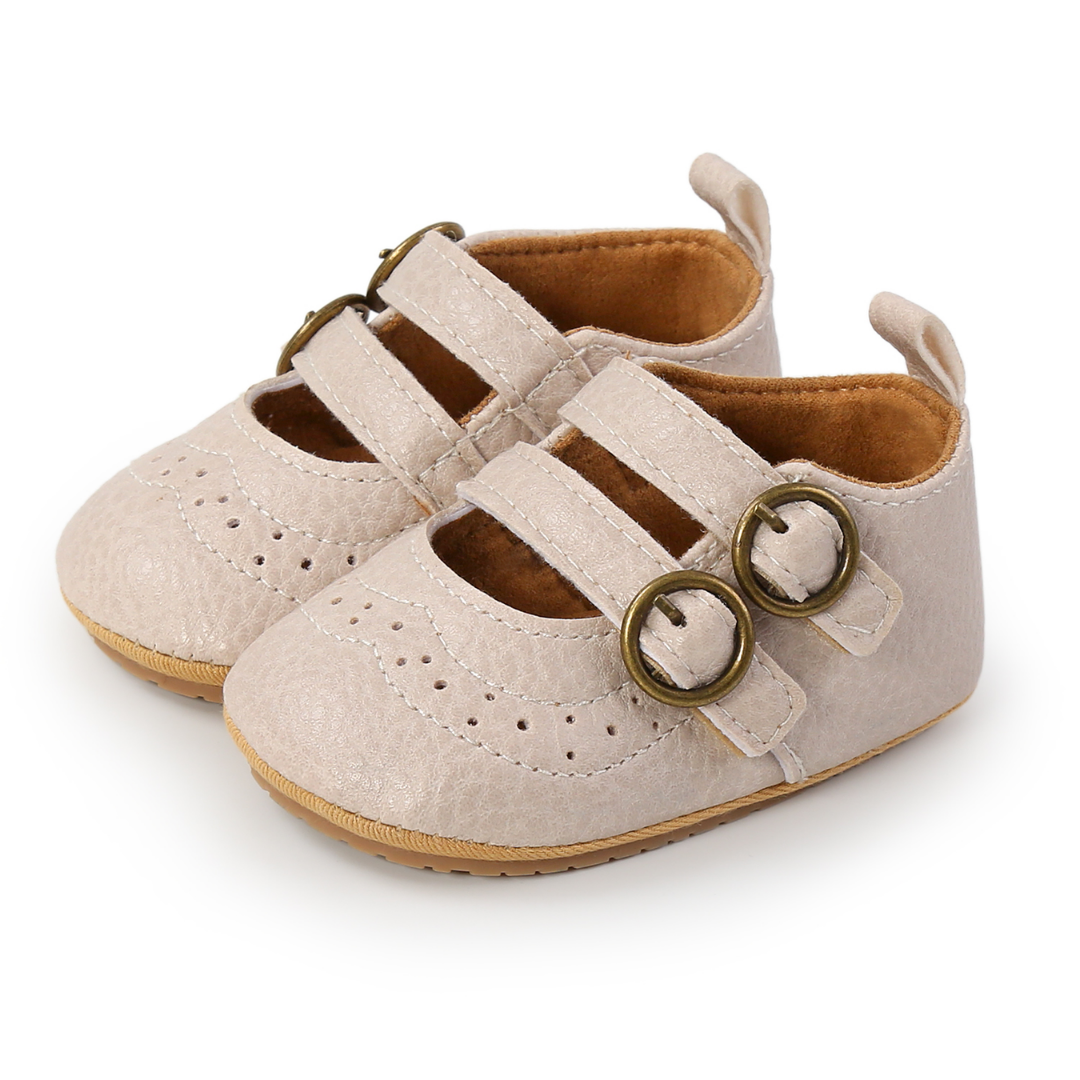Pair of baby girl's classic red first walker shoes, perfect for early steps with anti-slip design.