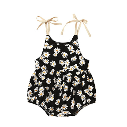Infant girl in a soft cotton sunflower print romper, ideal for warm weather activities.