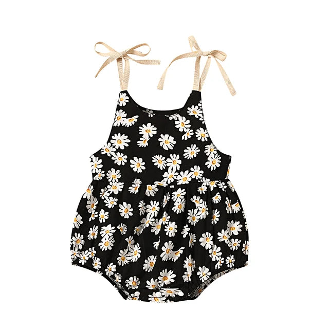 Toddler girl's summer outfit: comfortable cotton romper dress with an all-over sunflower print.