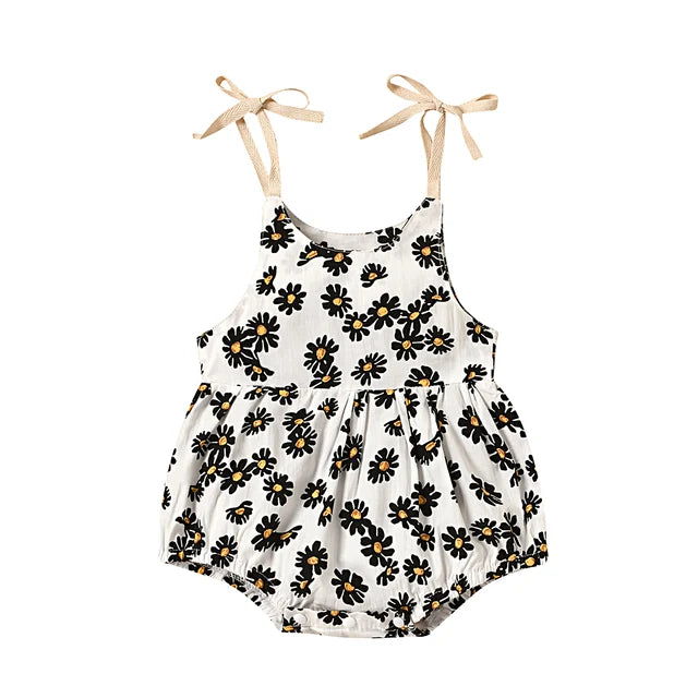 Cute girls' cotton romper dress adorned with bright sunflowers, suitable for sunny days.