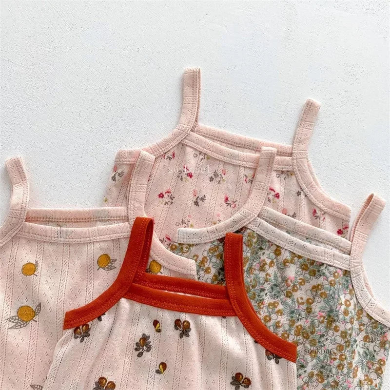 Cute baby girl's cotton summer outfit with a colorful camisole top and shorts, great for warm weather.