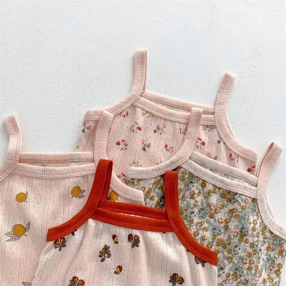 Cute baby girl's cotton summer outfit with a colorful camisole top and shorts, great for warm weather.