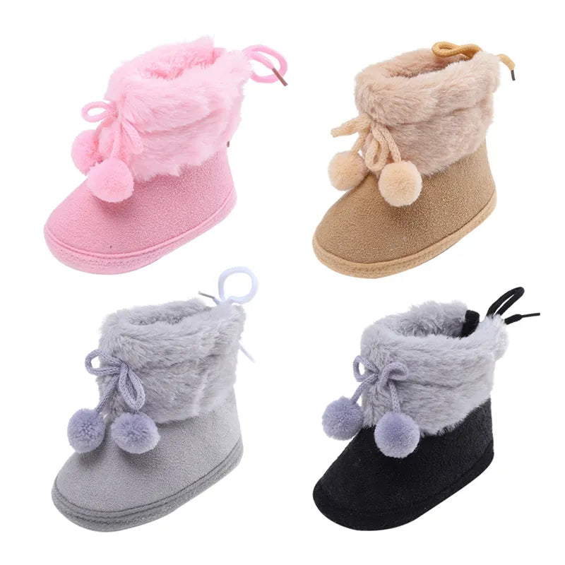 Pink baby girl infant shoes, winter snow booties with warm fluff ball detail, first walkers