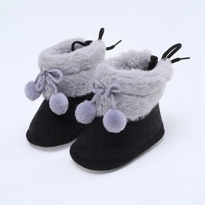 Baby girl winter essentials: pink fluff ball booties with soft sole, cozy and cute for infants