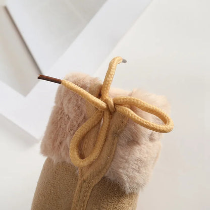 Cozy pink fluff ball baby girl winter booties, soft sole for playful first steps and warmth