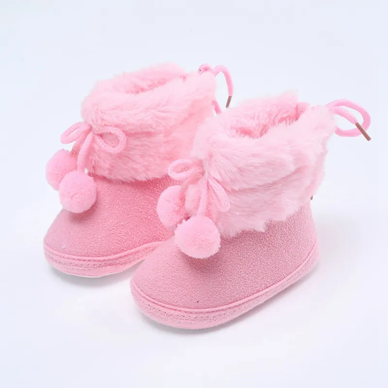 Warm pink baby girl infant shoes, winter snow booties with decorative fluff ball, soft sole