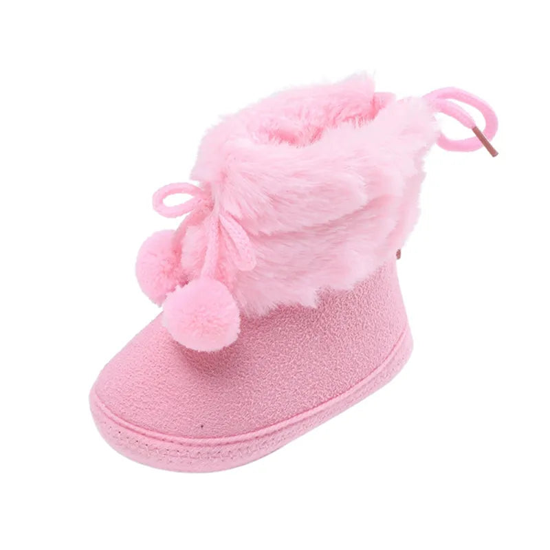 Adorable baby girl winter boots, pink soft sole booties with fluff ball accent for infants