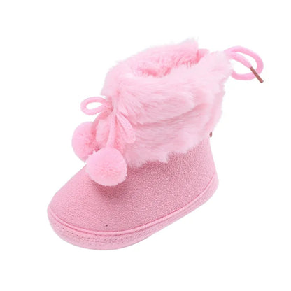 Adorable baby girl winter boots, pink soft sole booties with fluff ball accent for infants