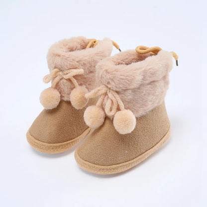 Cute pink baby girl winter boots with fluff ball, ideal soft sole booties for infants