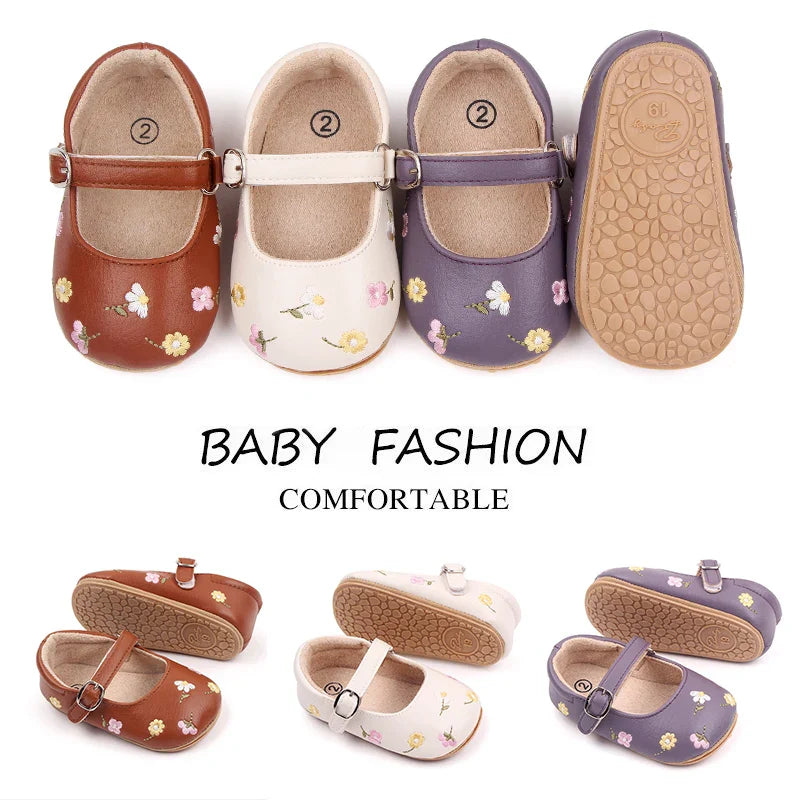 Cute pink baby sandals with intricate flower embroidery, perfect for summer