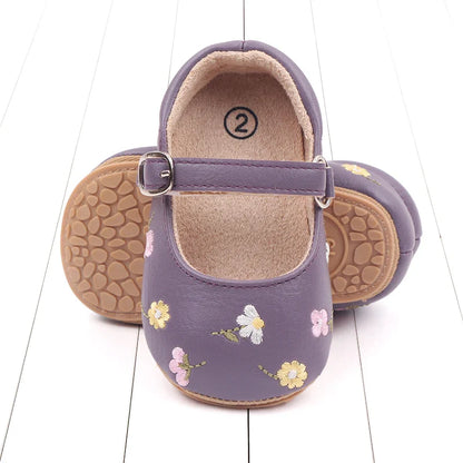 Stylish baby girl's sandals with embroidered flower detail for summer outings