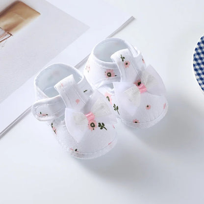 Infant footwear: baby girl's floral bow soft-soled crib shoes, comfortable and stylish for little feet.