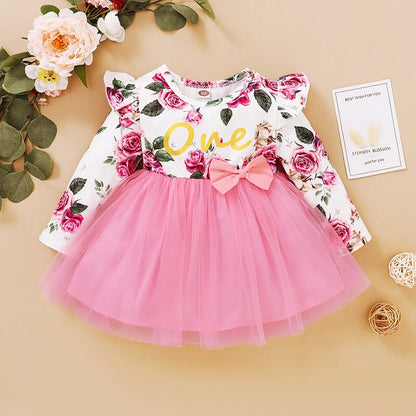 Adorable baby girl's floral butterfly long sleeve dress, a charming addition to kids' fashion.