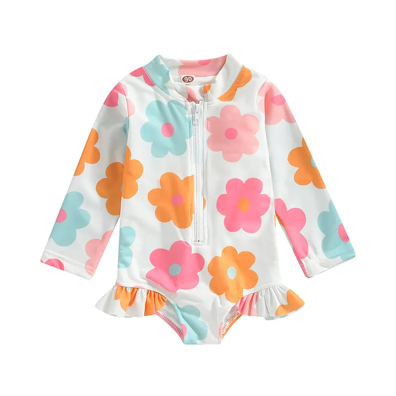 Baby girl's floral ruffle one-piece swimsuit with pink and white flowers, perfect toddler beachwear.