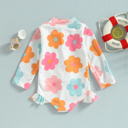 Sweet baby girl's floral print one-piece swimsuit with ruffles, great for beach vacations.