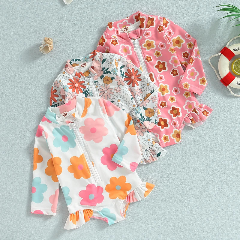 Comfortable floral ruffle one-piece swimsuit for baby girls, made from soft polyester for kids.