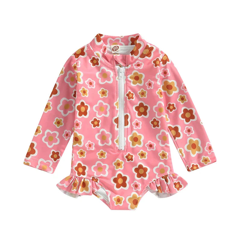 Pink and white floral one-piece swimsuit with ruffles for baby girls, trendy toddler bathing suit.