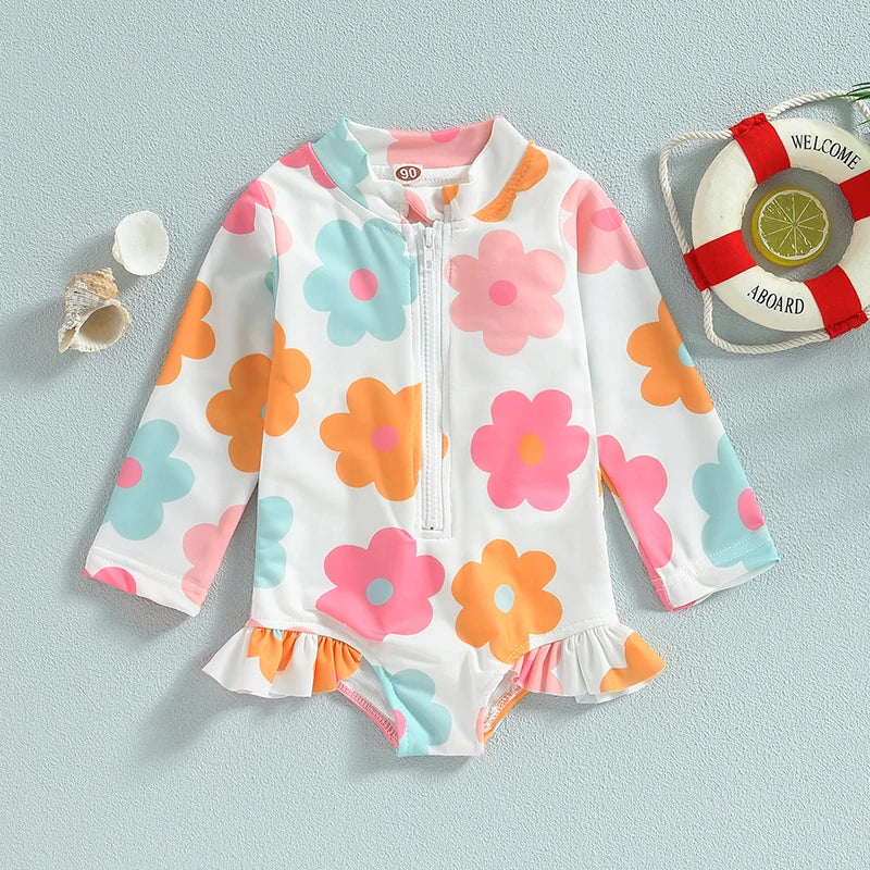 Delightful baby girl's floral one-piece swimsuit with playful ruffles, excellent infant pool wear.