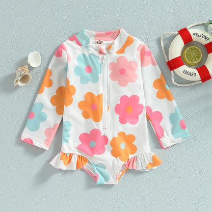 Delightful baby girl's floral one-piece swimsuit with playful ruffles, excellent infant pool wear.