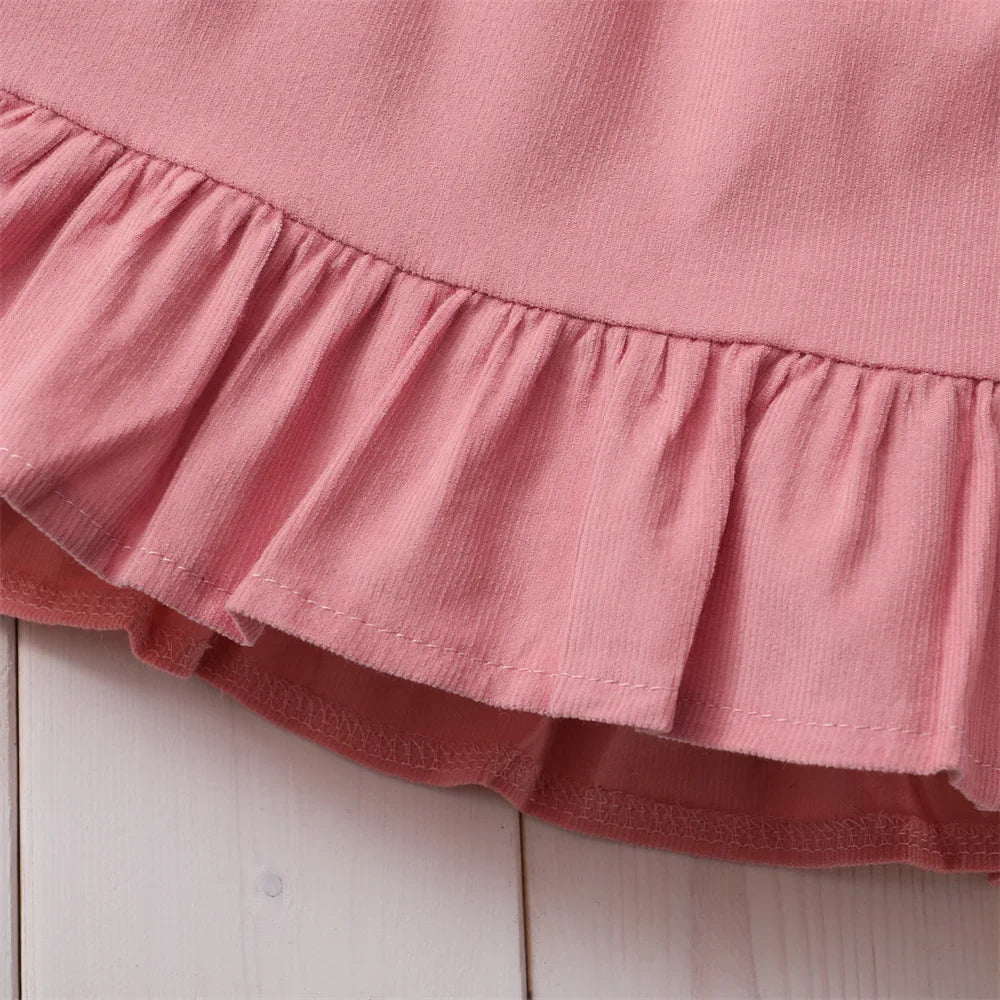 Sweet baby girl in a delightful floral skirt and charming matching headband set