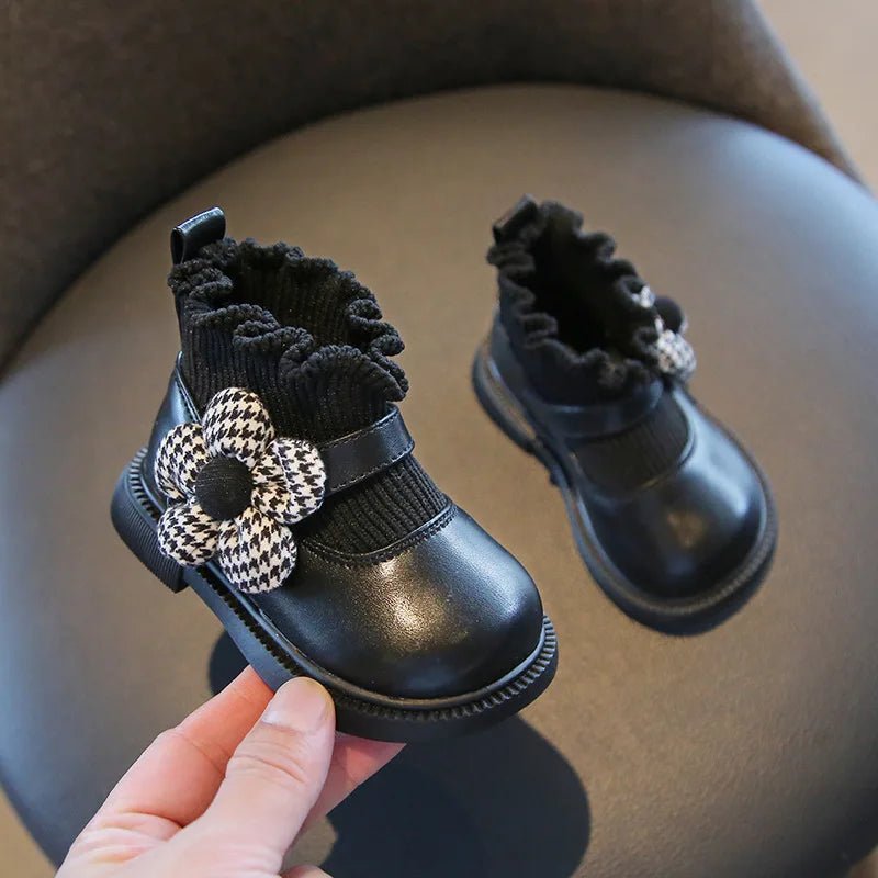 Close-up of girls floral soft sole walking boots, showing intricate flower pattern and quality cotton fabric