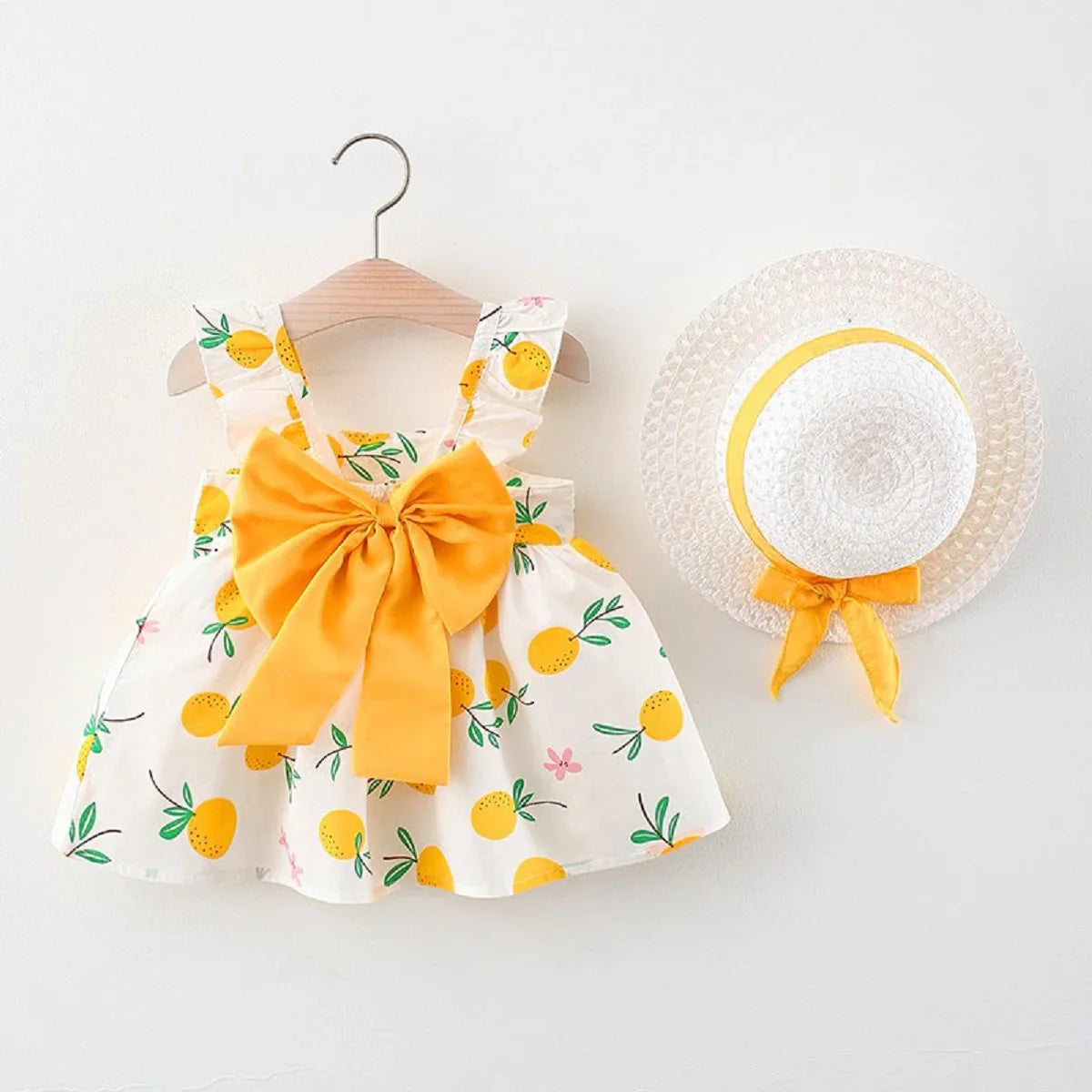 Toddler girl's casual fruit print cotton dress and sun hat with a cute bow.