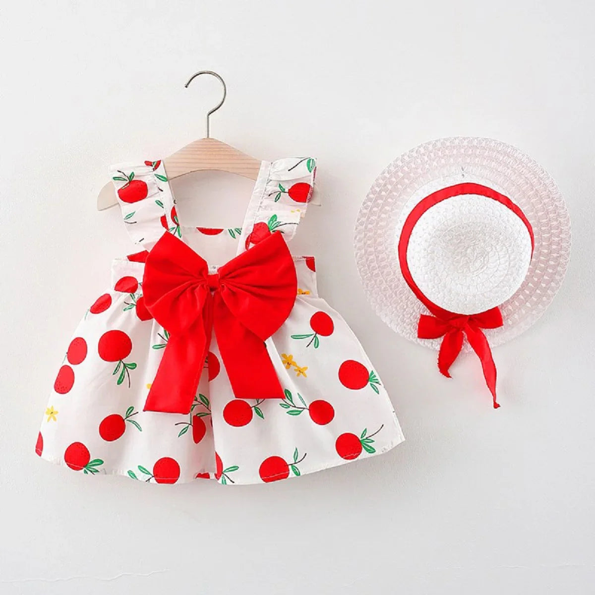 Girls' cotton fruit print sleeveless dress and a protective matching sun hat.