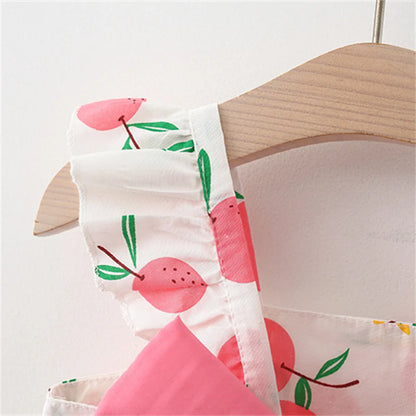 Soft cotton baby dress with a vibrant fruit print and a matching broad-brim hat.