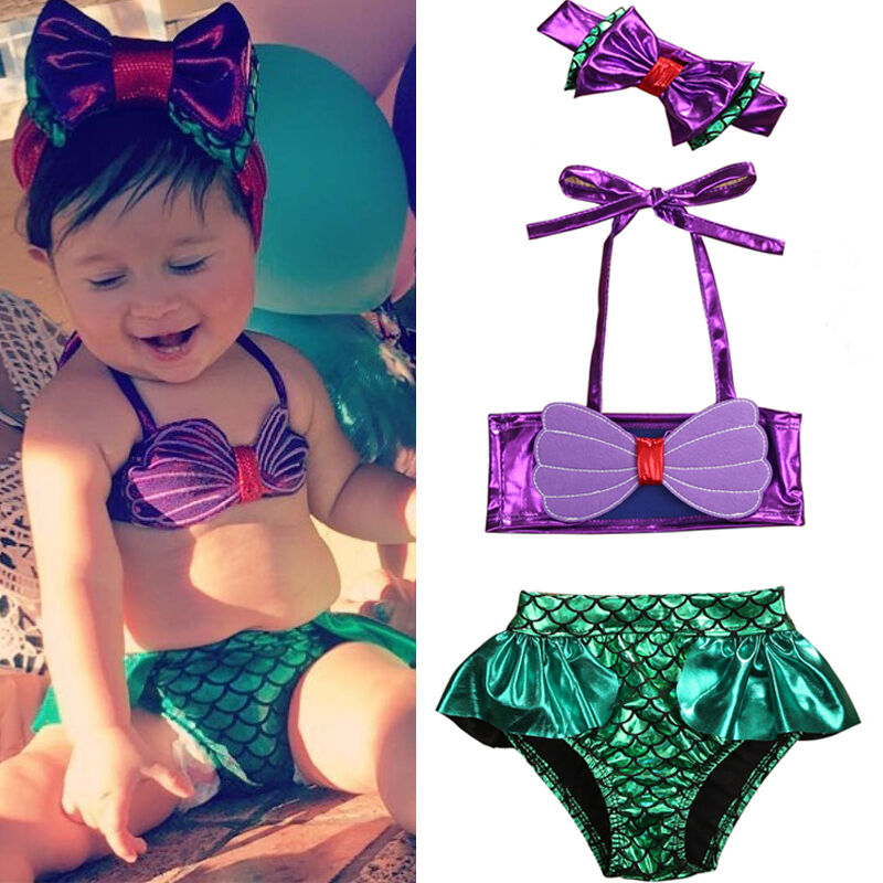 Baby girl's mermaid princess swimsuit set with shimmering scales and ruffle trim for beach fun