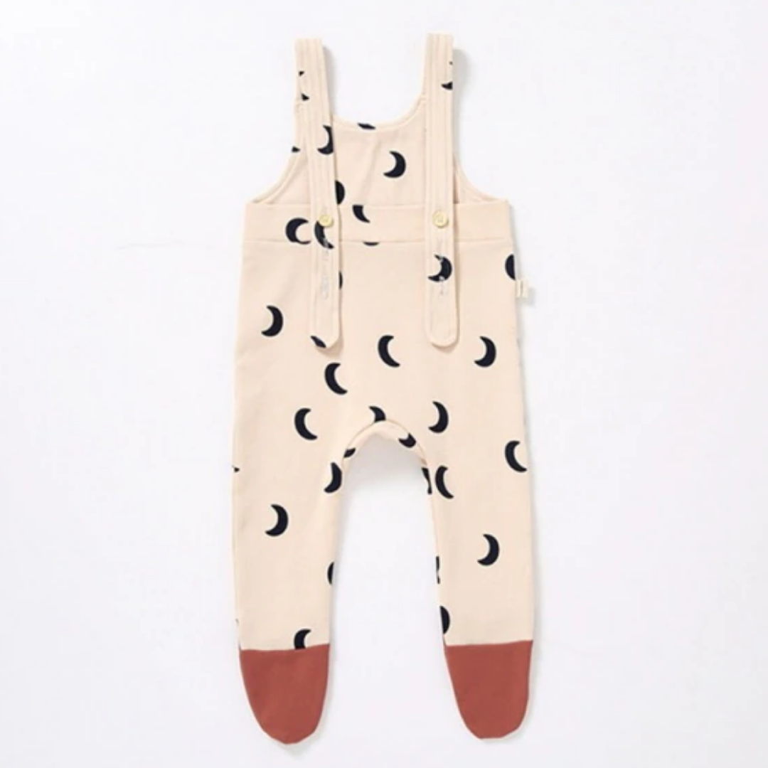 Infant girl's minimalist sling legged trouser jumpsuit, soft cotton, perfect for toddler fashion.