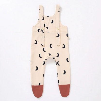Infant girl's minimalist sling legged trouser jumpsuit, soft cotton, perfect for toddler fashion.