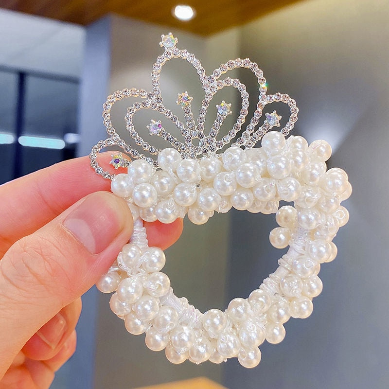 Set of assorted baby girl crown headbands with pearls, perfect for various looks