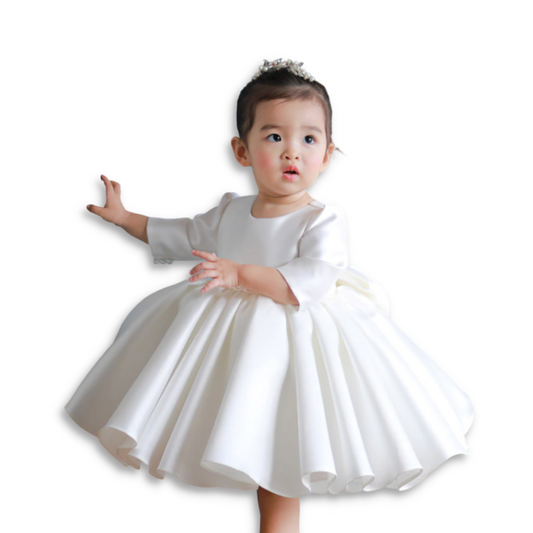 Baby girl's pearl white baptismal gown with delicate lace, perfect for christening or special occasions.