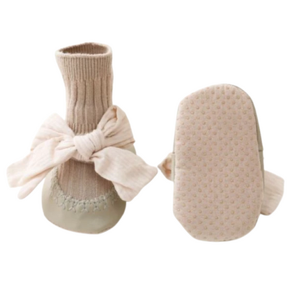 Collection of various colored anti-slip cotton sock walker shoes for baby girls, featuring bowknot designs