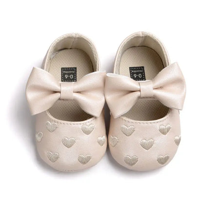 Breathable first walker shoes for baby girls, showcasing non-slip sole and pretty pink color