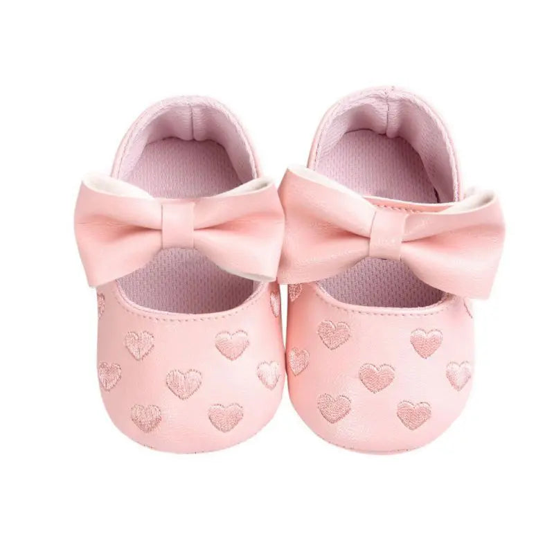 Infant footwear: pink baby girl shoes with bow, ideal for first steps, non-slip and breathable