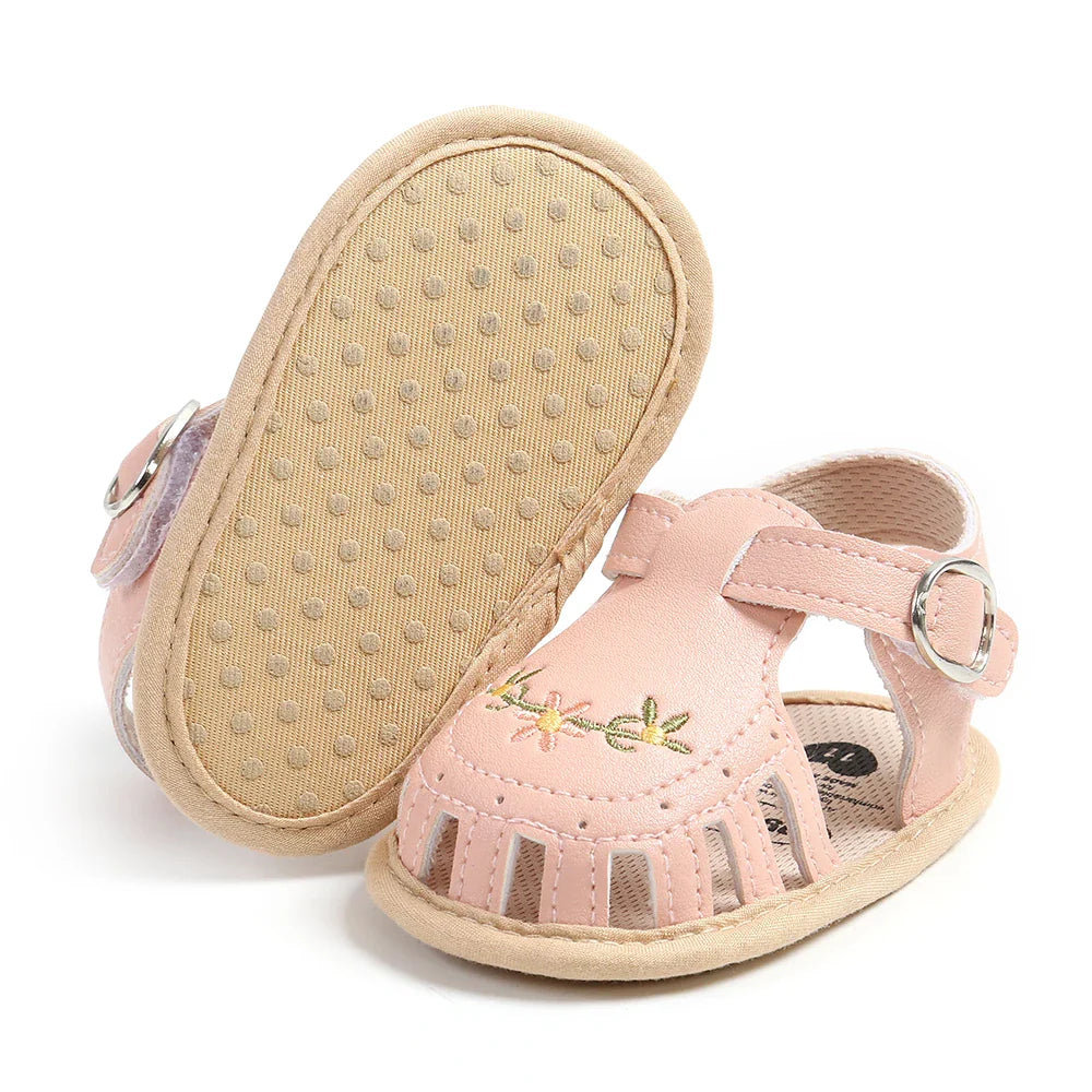 Top view of a pair of colorful baby girl's summer sandals, soft and adjustable