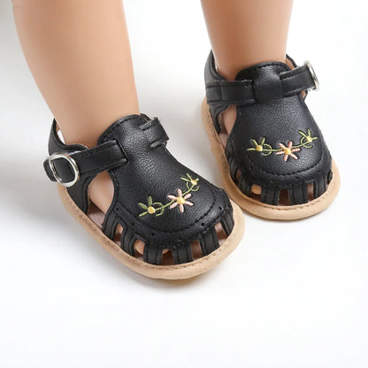 Side profile of a baby girl's ergonomic, lightweight summer sandal for active infants