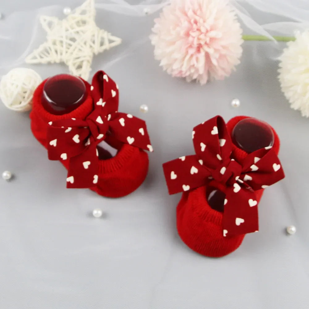 Essential baby girl anti-slip bow socks in pure cotton for delicate skin